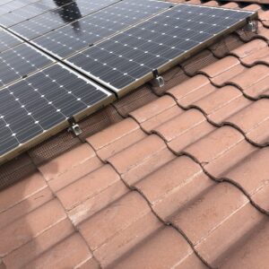 Solar panels pigeon proofed on an s-tile rooftop