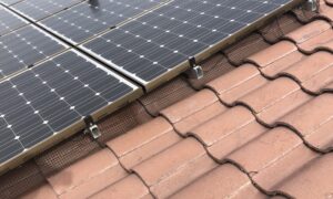 Solar panels pigeon proofed on an s-tile rooftop