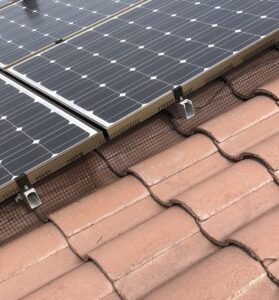 Solar panels pigeon proofed on an s-tile rooftop